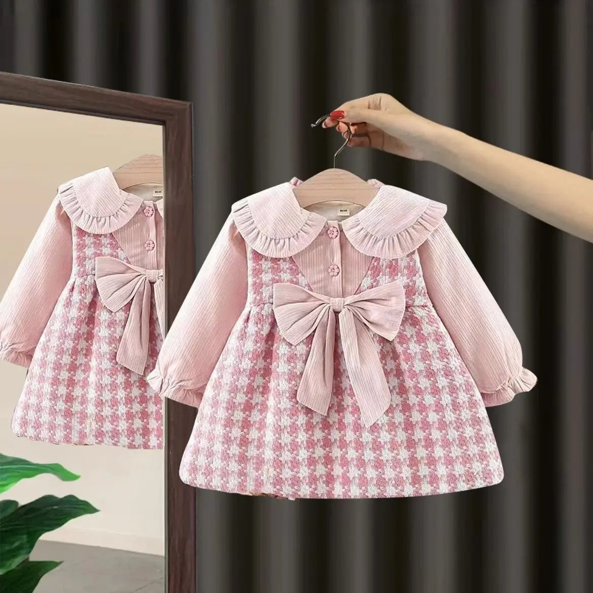 Holding an adorable Chequered Style Pink Princess Skirt Baby Girl