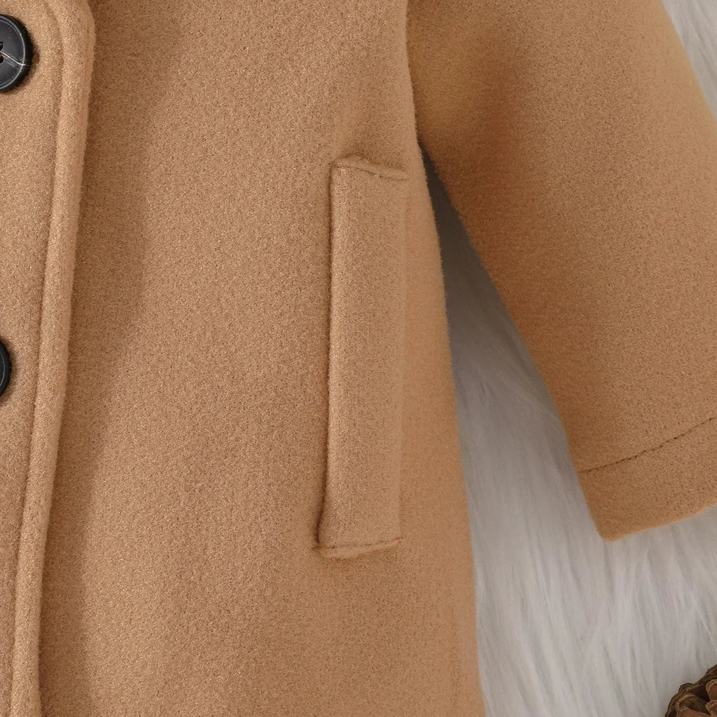 zoom in of adorable Khaki Long Sleeve pocket baby coat